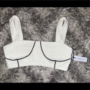 Never worn with tags WEWOREWHAT active wear corset top in white